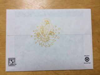 gold ink doodle on the back of an envelope