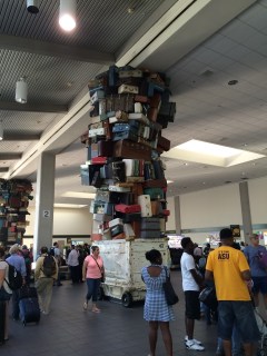 Art composed of old-fashioned luggage at baggage claim in Sacramento