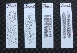 Homemade ZIA bookmarks numbered First through Fourth.