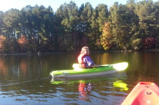 Girl in plastic kayak