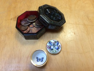 One opened inlaid box displaying coins, one open enamel box displaying painted butterfly on the bottom