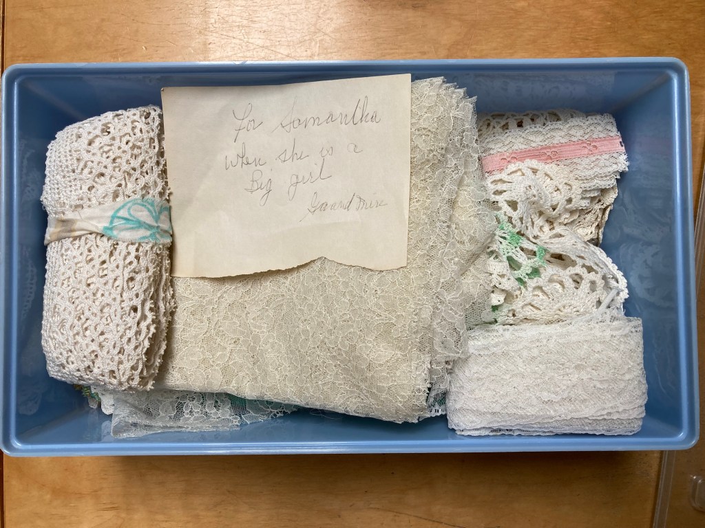 Photo shows box containing assorted kinds of lace and a handwritten note: For Samantha when she is a big girl, signed Grandmere.