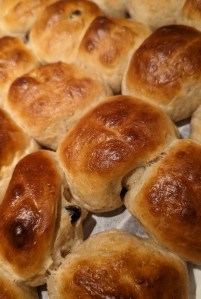 Egg-washed buns have golden, somewhat shiny tops.
